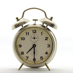 Old-style alarm clock, metal, it's half past seven.