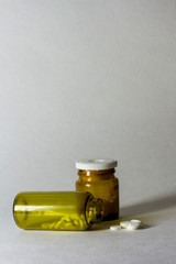 Jars of pills on a white background