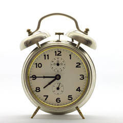 Old-style alarm clock, metal, it's quarter to eight.