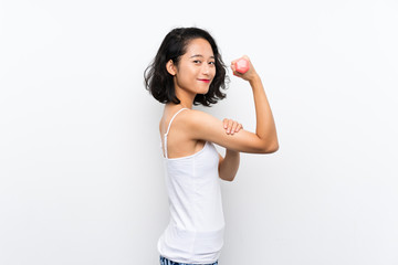 Young Asian girl making weightlifting over isolated background