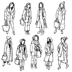 Winter women's fashion. Hand drawn girls on white background. Vector sketch illustration.