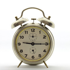 Old-style alarm clock, metal, it's quarter past nine.