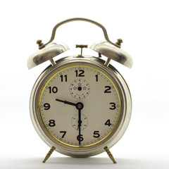 Old-style alarm clock, metal, it's half past nine.