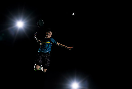 Asian badminton player is jump and hit the badminton ball Stock Photo |  Adobe Stock