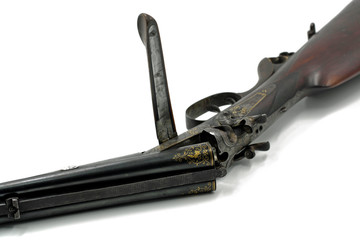 close up of old shotgun isolated on white background