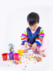 Asian little boy wearing a Korean Traditional Hanbok dress in white background
