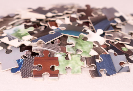 Pieces of a photo jigsaw on white background