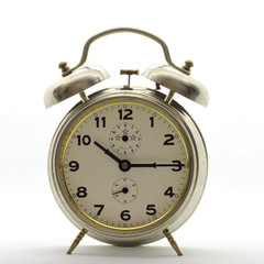 Old-style alarm clock, metal, it's quarter past ten.