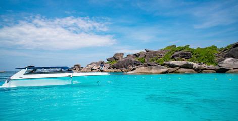 Fototapeta na wymiar Speed Boat in tropical sea Beautiful turquoise sea and blue sky background