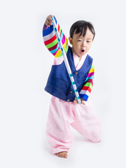 Asian little boy wearing a Korean Traditional Hanbok dress in white background