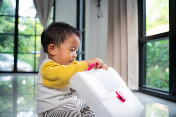 Baby toddler kids boy playing mirror window in modern house