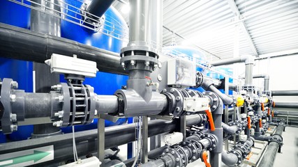 new plastic pipes and colorful equipment in industrial boiler room