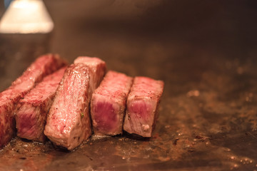 Barbecue Kobe steak, Selected focus on a dry aged Wagyu entrecote steak on hot plate.