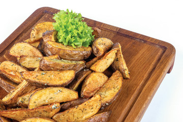 fried potato chips. home made in rural style and served on on wooden board. healthy organic vegetarian food or beer snack. close up view