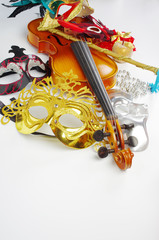 Violin, carnival masks on a light background