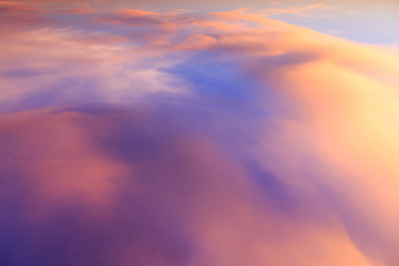 Abstract fantasy softly colorful mountain clouds background, Gold fog with sun highlight on blue sky and moving cloud before sunset by airal view