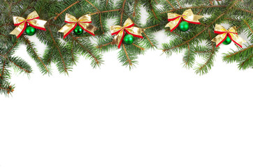 Christmas garland on a white background. Branches of spruce, balls and bows. Isolated on white.