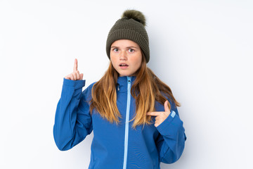 Ukrainian teenager girl with winter hat over isolated white background with surprise facial expression