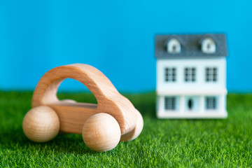 A car in the foreground, behind is a private country house the concept of a happy life