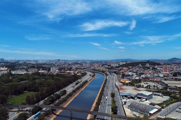 Obraz premium Aerial view of river between roads. Cityscape scenery. Great landscape. Marginal Tietê, São Paulo, Brazil