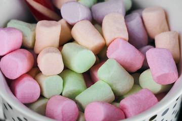 close-up of multi-colored marshmallows in a glass. New Year background. Christmas bright colors