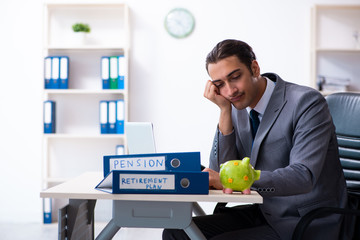 Young male accountant working in the office