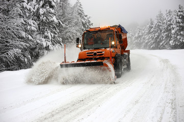 Snowplow. Forest roads full of snow and ice.