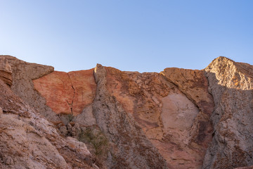 Fototapeta na wymiar Landscape of barren colorful rock formation or hill in the Mecca Wilderness of Southern California
