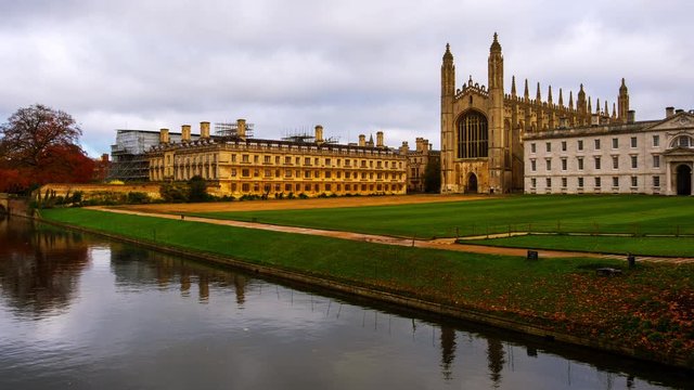 Cambridge, UK. View of Cambridge University with King College Chapel in Cambridge, England, UK during the cloudy autumn day. Time-lapse with boats in the river, zoom in