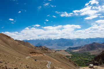 Ladakh, India - Jul 24 2019 - Beautiful scenic view from Between Khardung La Pass (5359m) and Leh in Ladakh, Jammu and Kashmir, India.