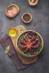 Whole steamed octopus with parsley and spices, copy space