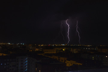 Lightning strikes between buildings during the storm