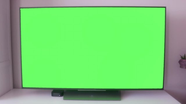 Home design, LCD led television with green screen, chroma key alpha channel. 