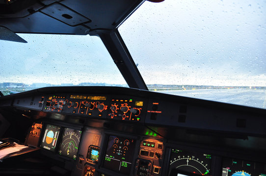 Airbus A320 flight deck from the first officer seat under the rain before starting the engines
