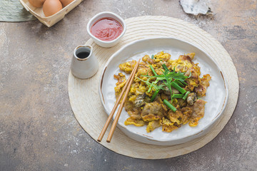 Oyster Omelette or or luak with sauce, copy space