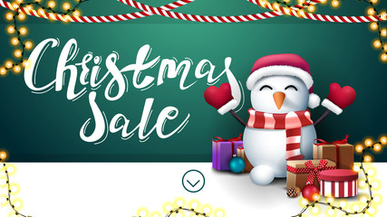 Christmas sale, green and white discount banner with garlands and snowman in Santa Claus hat with gifts near the wall