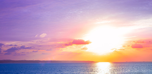 Naklejka na ściany i meble lilac sunset over the sea