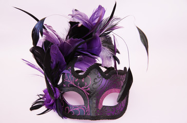 Carnival venetian mask isolated on a pink background. Holiday and masquerade concept.