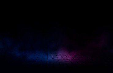 Empty background scene. Dark street, reflection of blue and pink neon light on wet pavement. Neon shapes. Rays of light in the dark, smoke. Abstract dark background.