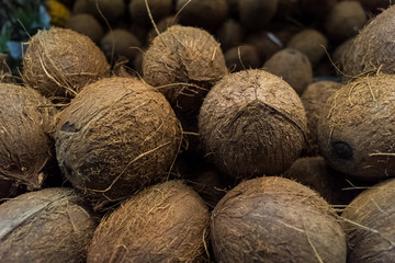 Pile of coconuts in supermarket