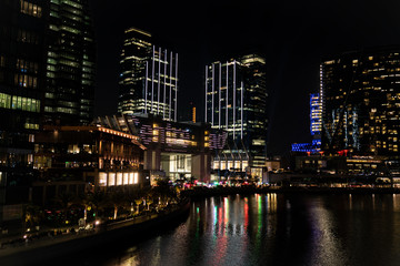 Fototapeta na wymiar Epic view of city skyscrapers at night - Al Galleria Boutique mall, Abu Dhabi city landmarks, UAE
