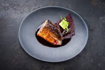 Minimalistic design Japanese salmon fish filet with vegetable and nori glazed in teriyaki sauce as...