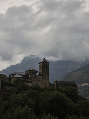 Fototapeta premium The Church of Torla and the walls of Mondarruego in the National Park of Ordesa and Monte Perdido in the Pyrenees of the province of Huesca. Aragon. Spain