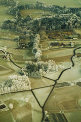 A frozen landscape seen from an airplane.
