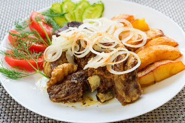 Lamb stew with vegetables. Baked Potato and fresh vegetables with lamb.