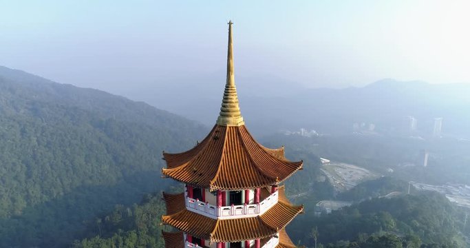 Aerial view orbiting of Chin Swee Caves Buddha Temple Tower at Genting Highlands, Malaysa. 4K
