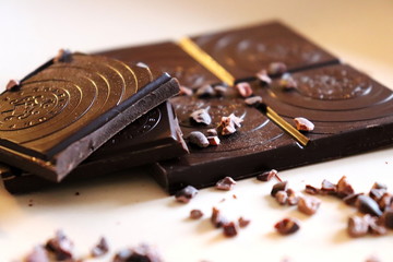 pieces of chocolate on wooden background