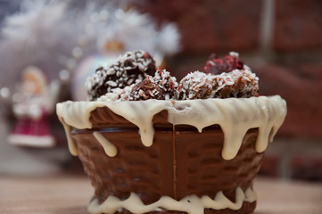 xmas gift. handmade confection. Homemade candy in chocolate basket. sweet souvenir present. candy shop. festive sprinkle and topping. vintage retro chocolate. sweets at christmas tree. happy new year