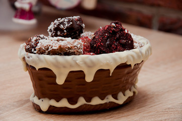 retro vintage chocolate. sweets at christmas tree. happy new year. xmas gift. handmade confection. Homemade candy in chocolate basket. sweet souvenir present. candy shop. festive sprinkle and topping