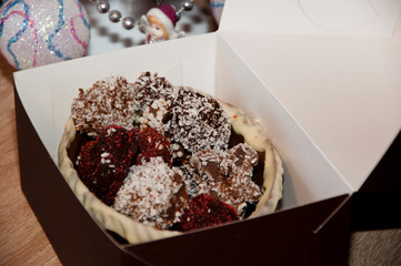 sweet souvenir present. Truffles and Marzipan in box. candy shop. sprinkles and topping. homemade chocolate. sweets at christmas tree. happy new year. xmas gift. Homemade candy in chocolate basket